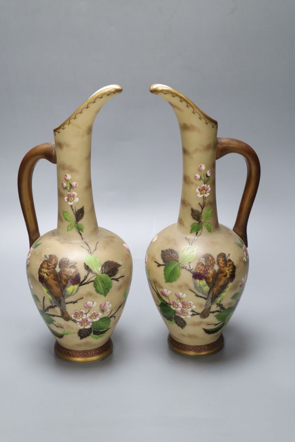A pair of Victorian opaline glass ewers, height 34cm